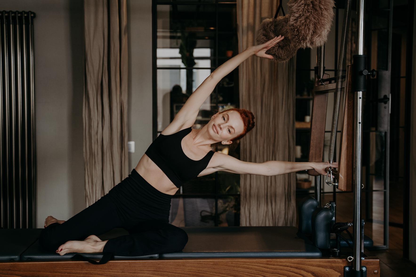 Young Athletic Woman during Pilates Training