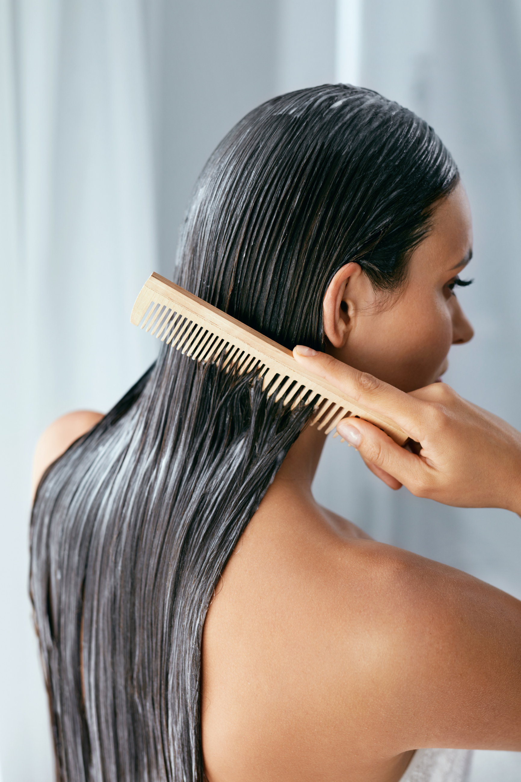 Hair Treatment. Woman With Mask On Wet Hair Closeup